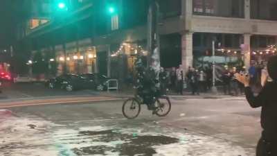Bike cop hit by water.
