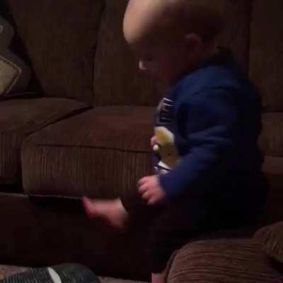 Cute child falling while playing