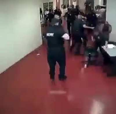 Corrections officers caught on camera brutally beating a black inmate after he punched 1 of them.