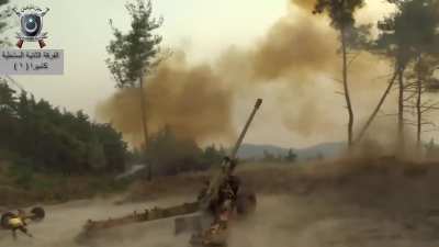 Syrian rebels loading and firing a M46 130mm howitzer/artillery piece in Latakia province. Video posted 4 August 2015.