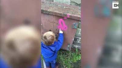 Little Kid Mistakes Rude Grafitti For Headphones
