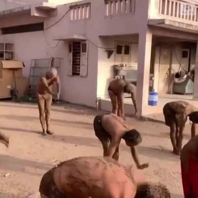 In India, people are covering themselves in cow dung and urine as a Covid-19 cure