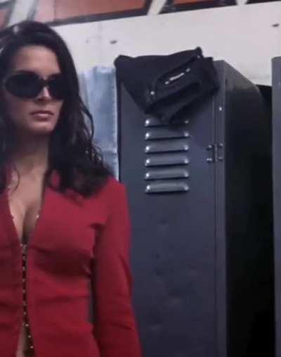 Angie Harmon in her iconic red outfit in Agent Cody Banks