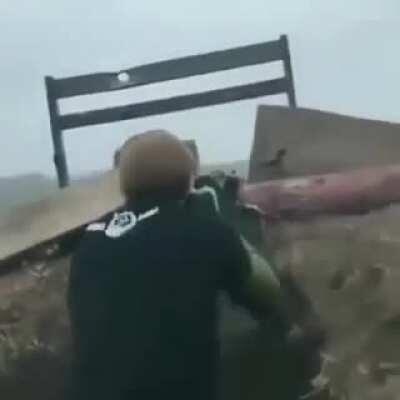 Ukraine soldiers, possibly Chechen fighters, fire a PKM at Russian militants while listening to hard bass