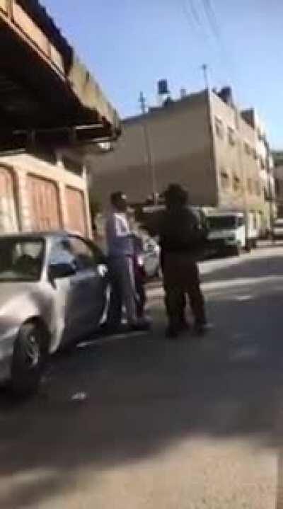 Israeli Soldier Points Gun at Unarmed Arab Man Walking With His Young Son