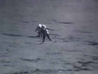Sped up footage of astronauts jumping and tripping on the moon.