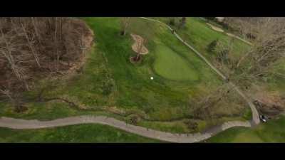 (tracking a golf ball) Maybe he'll hit the green next time.