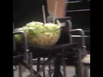 [Haiku] A bowl of salad in the seat of a wheelchair rolling down the street unassisted (with Diana Ross)