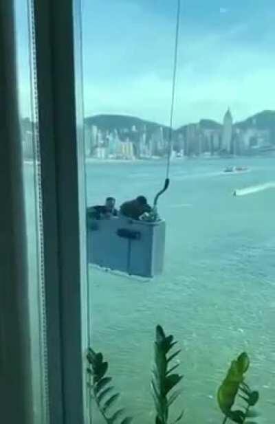 Cleaning windows on a windy day.