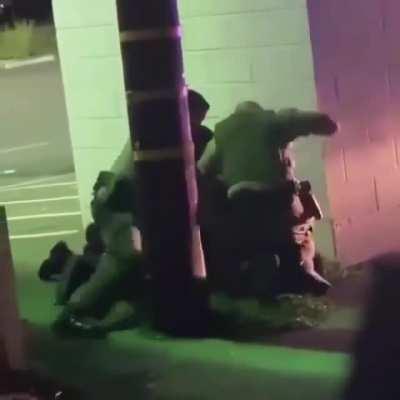 They secluded him behind a wall and looked around to see if anyone was watching so they can beat him... this is why we protest