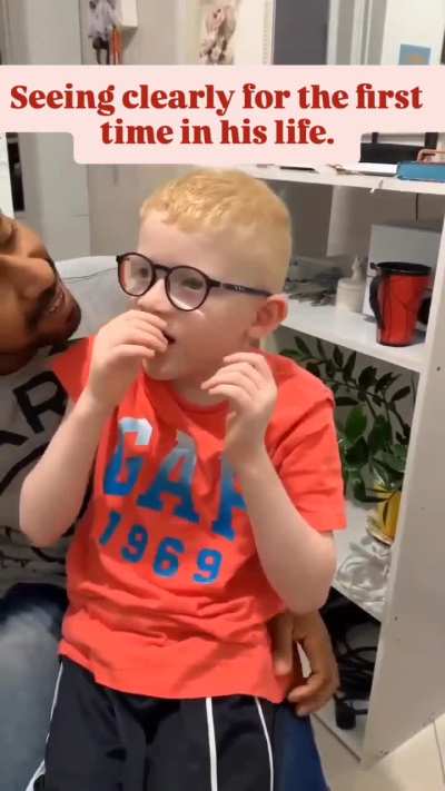 With much love, patience, and affection, the father succeeds in helping this young boy with albinism put on glasses so he can see clearly for the first time. Well done!