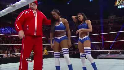 Nikki Bella rolling Naomi up