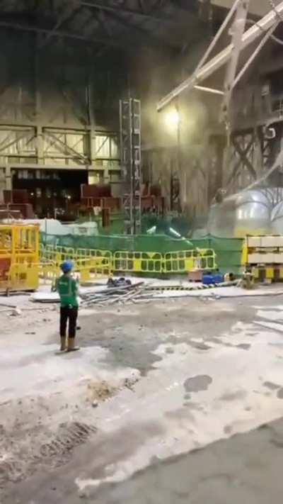 Track hoe, breaks chains and falls down pit