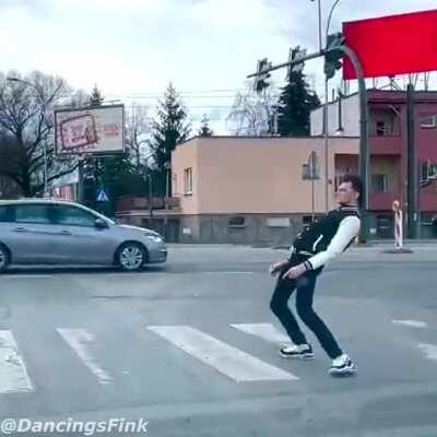 Chad dances at traffic light stop