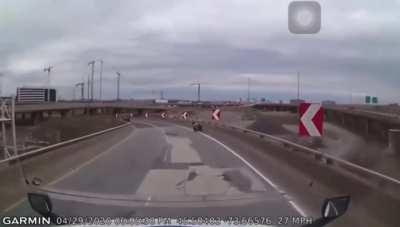 Motorcyclist falls off highway ramp