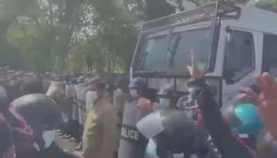 Remarkable scenes in Myanmar: Police openly join protesters as they are being shot with water cannon