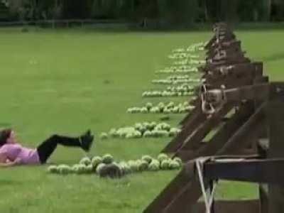 ECGW Playing with giant slingshot using watermelon ammo