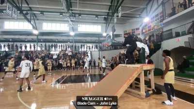 Rollerblade cam op goes up ramp, somewhat simulating a handheld crane shot.