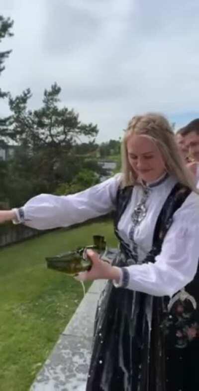 Trying to open the bottle with a knife