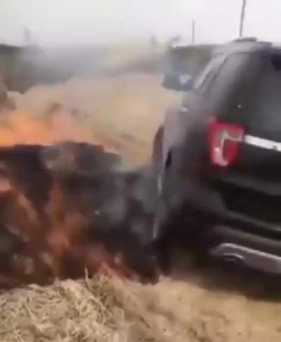 Car ignites dry hay trying to get unstuck, catches on fire instead