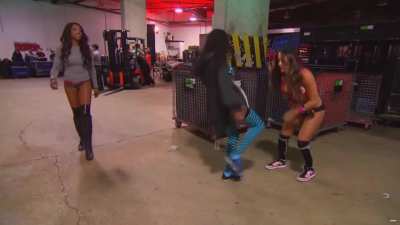 Naomi practicing low blows on Nikki Bella backstage