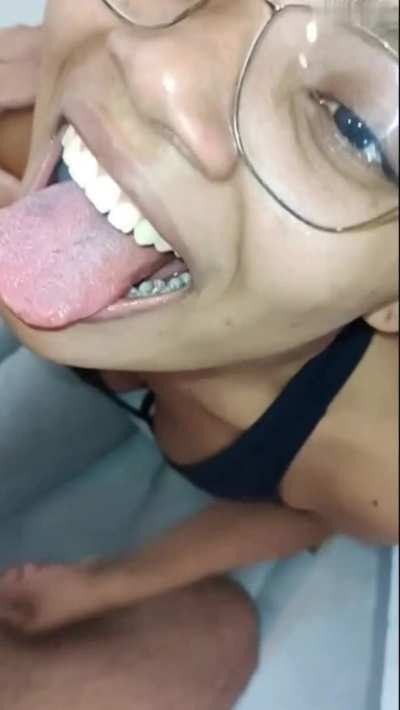 She loves showing off her tongue before sucking him off