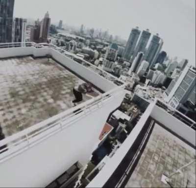 Crazy dudes doing a bunch of insane things in a building of idk how many fucking height