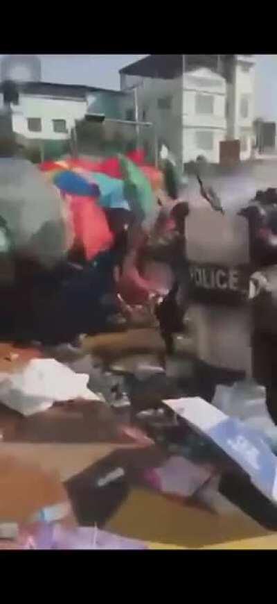 The police beating the protestors in Yangon, Myanmar