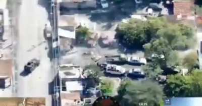 Haitian drone footage of an operation against a gang stronghold featuring an armored bulldozer