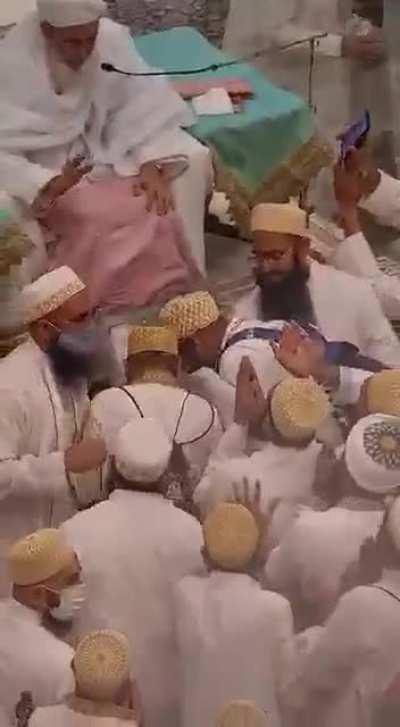 This happened this Saturday…. Talk about your super spreader event..Notice how well protected the cult leader is..