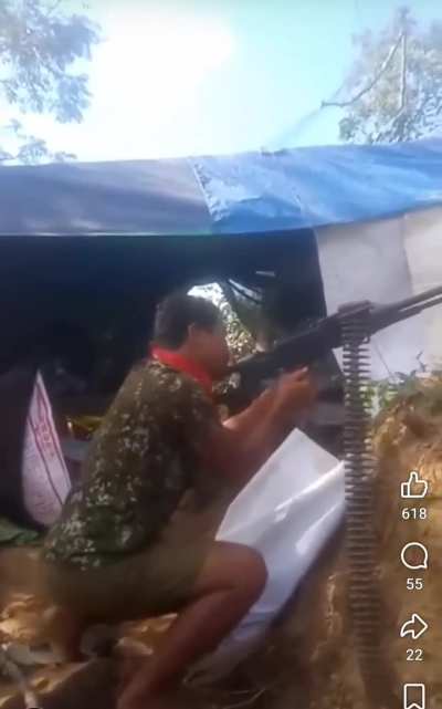 Cambodian Soldier firing a machine gun toward Thai positions during border skirmish - December 19 2025.