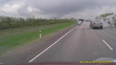 Car crashes head-on into a truck