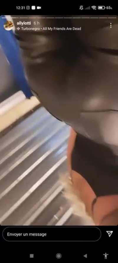 Ally showing her cleavage and her ass in leather