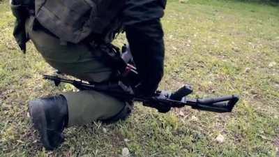 How to reload an AK-47 with an injured arm.
