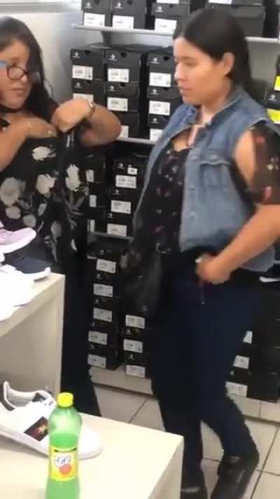 She got caught trying to steal shoes.