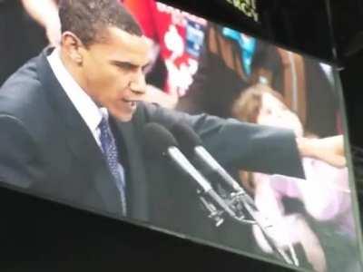 7 year old me on the jumbotron behind Obama. Chewing gum and watching myself the whole time.