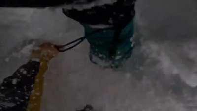 Skier saves the life of snowboarder stuck upside down in the snow.