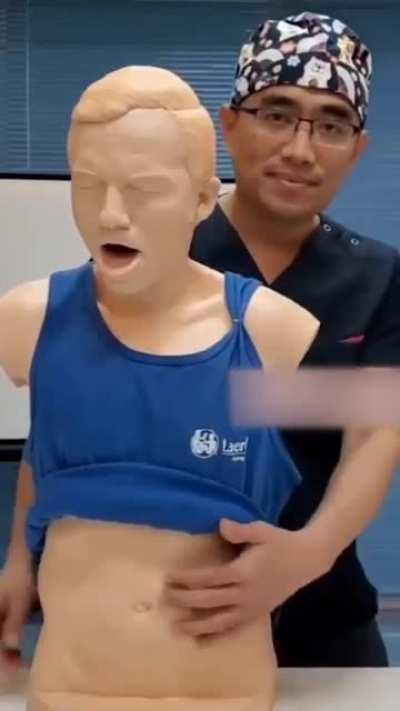 Demonstrating the Heimlich maneuver.