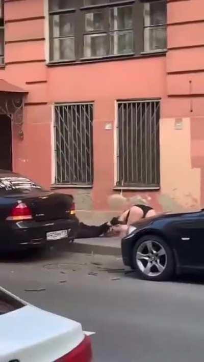 Battling couple fall from third story balcony.