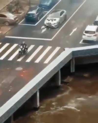 Turn left under the brown river