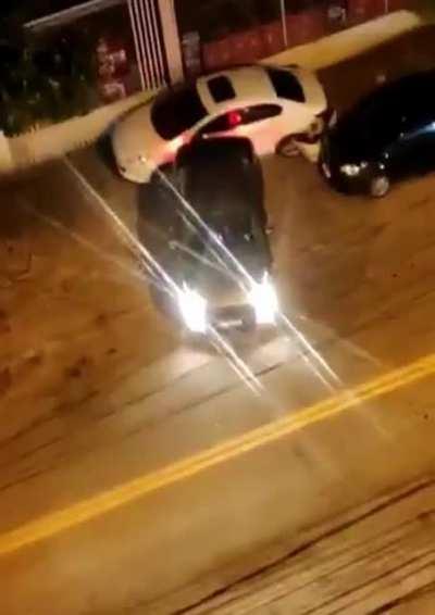 Parking in front of someone's garage in Brazil