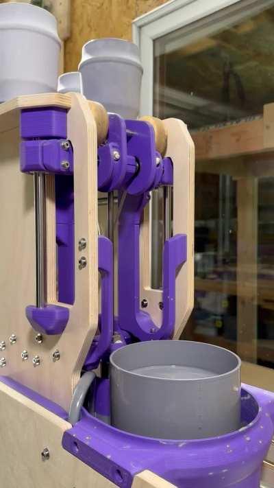 I made this machine to glaze mugs for me. These are the first few out of the kiln.