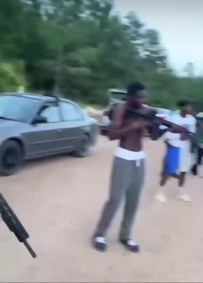 Just casually flagging the camera man with loaded weapons