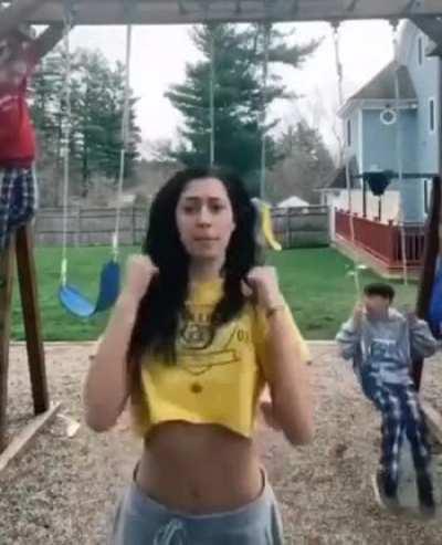 To make a TikTok in front of swinging kids