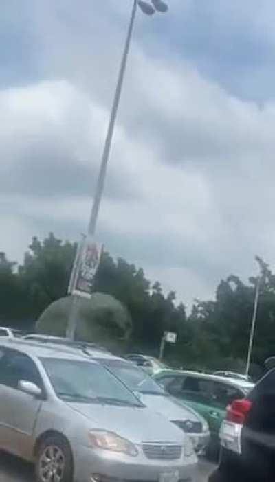 The Nigerian air force having practice parachute landings right in the middle of the city.