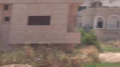 FSA fighters suppress the upper floors of an SAA occupied building to help extract a fighter wounded attempting to storm said building - Daraa al-Balad - 8/21/2013
