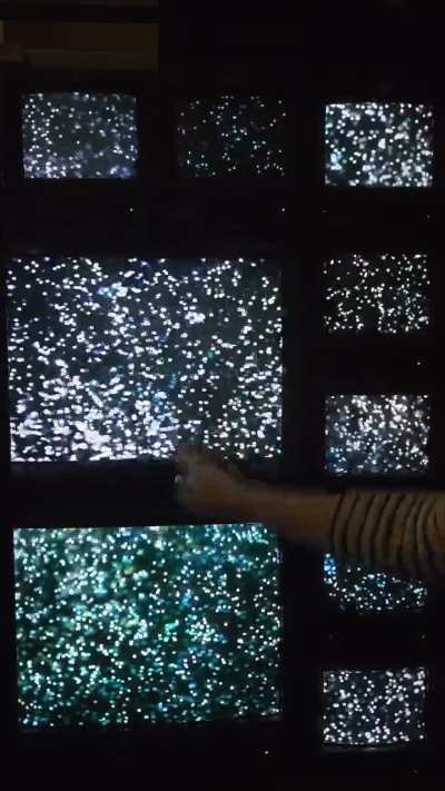 The interactive particles on this CRT Wall Setup