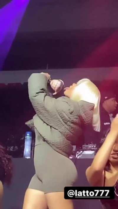 Latto pretending to jerk a dick off on to her tongue live on stage