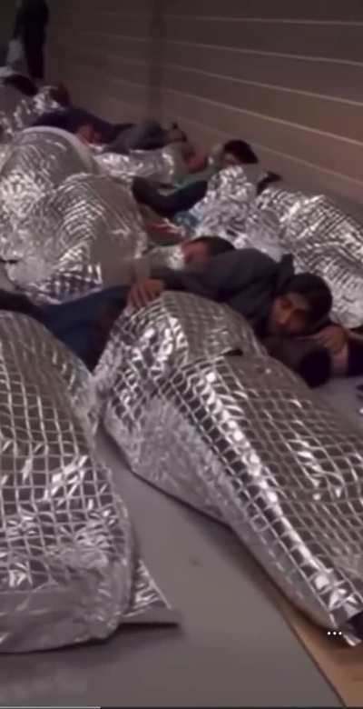 Leaked footage from inside of a ICE detention facility near Houston. No beds, no bathrooms, hundreds of men and women in one combined cell/room. The A/C is permanently kept on max to freeze people. 