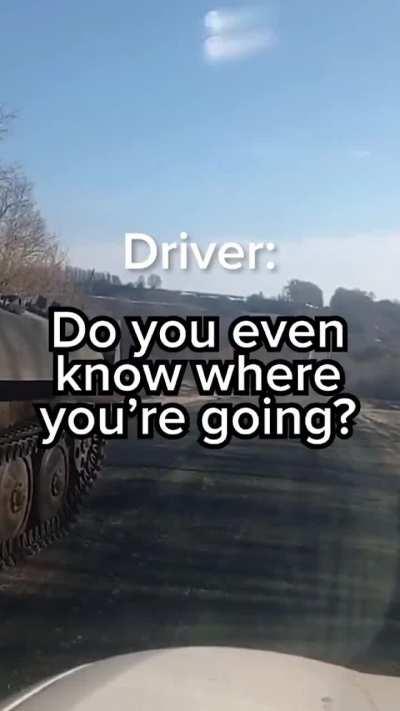 Ukrainian driver jokes with Russian soldiers